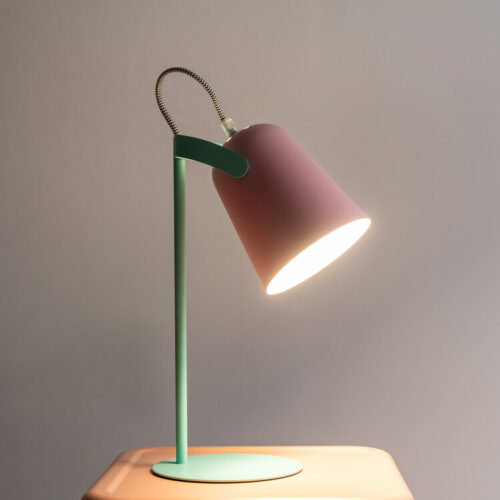 Pink and green modern lamp in bedside table